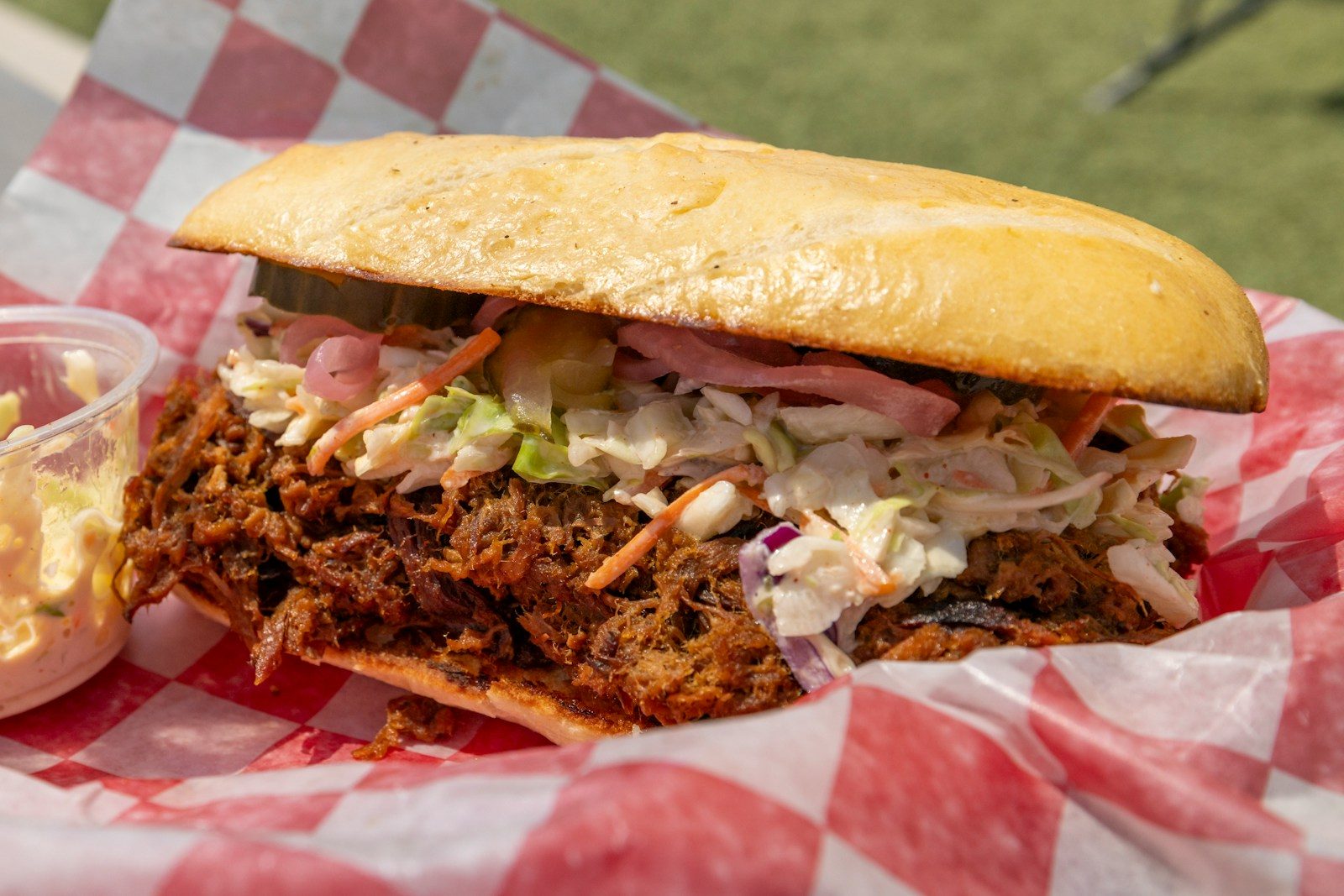 Pulled pork sandwich with coleslaw and pickles